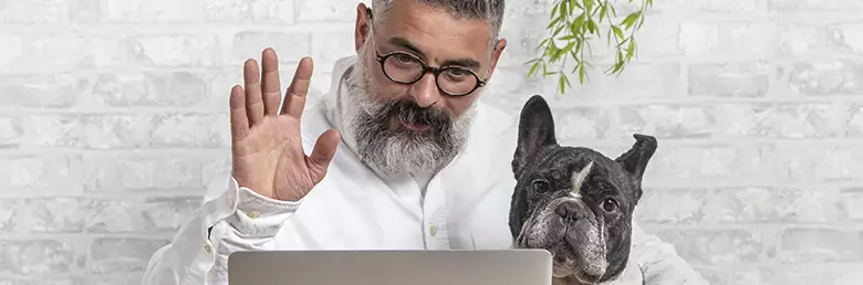 man with dog needing help with computer problem